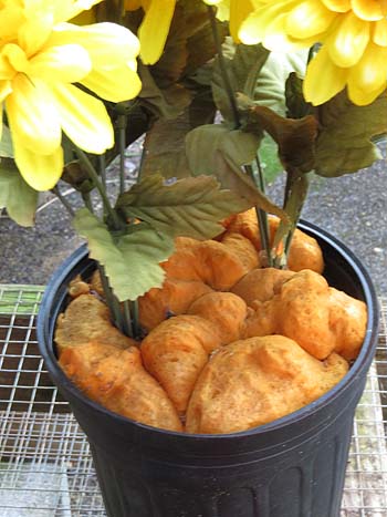 silk flowers in pot with great stuff